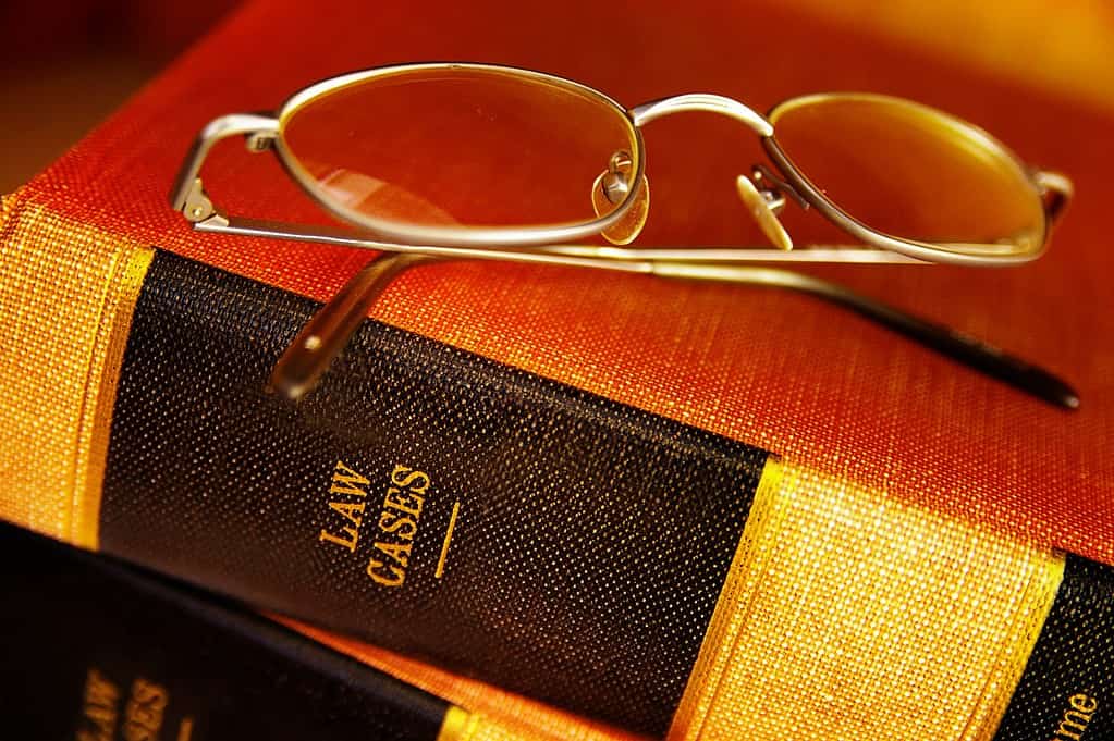 Closeup of eye glasses on top of legal books