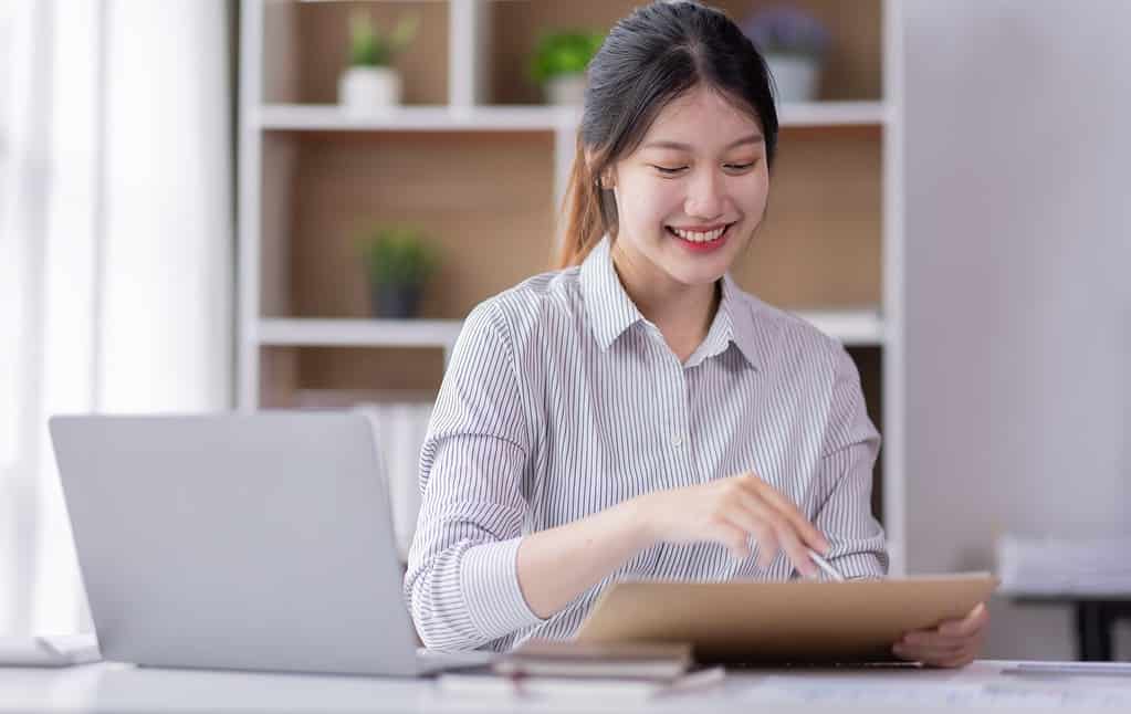 Business Documents, Auditor business Asian woman checking search
